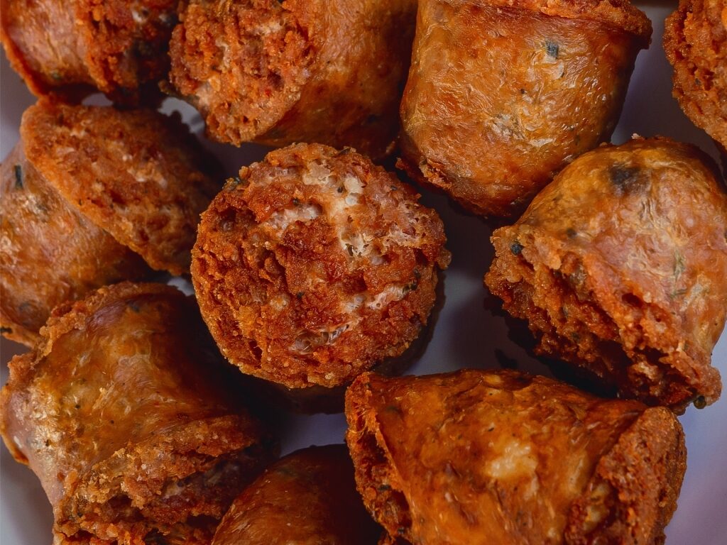 Slices of Dominican longaniza on a plate