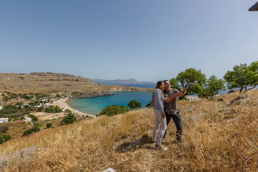 Couple hiking in Acropolis of Lindos, Rhodes