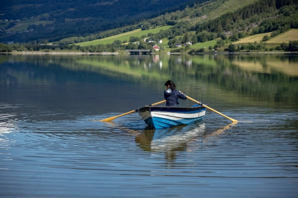 Woman on a boat ride in Lovatnet, Olden