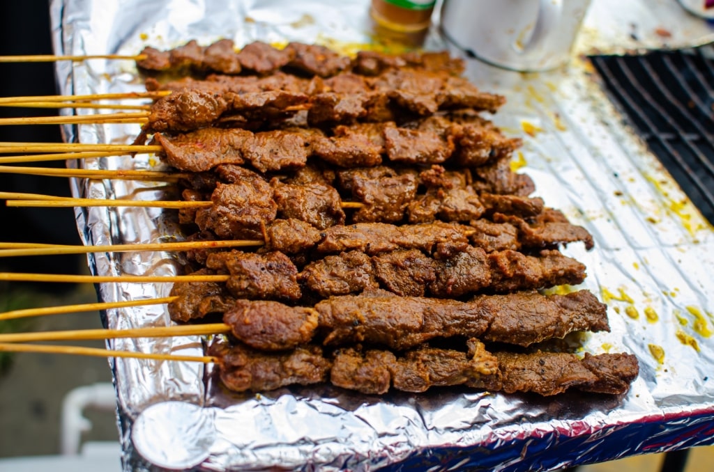 Carne en palito at a street food stall