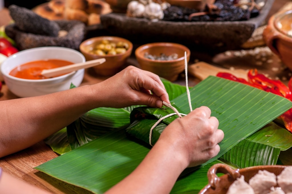 Person wrapping tamales