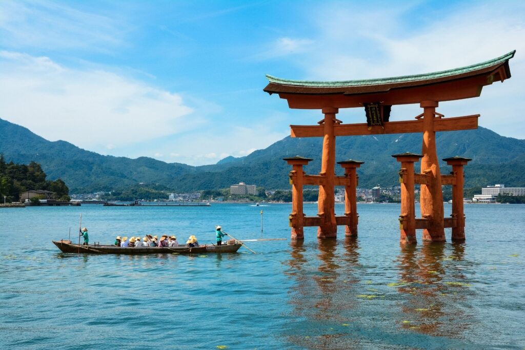People boating around Itsukushima Shrine in Miyajima Island