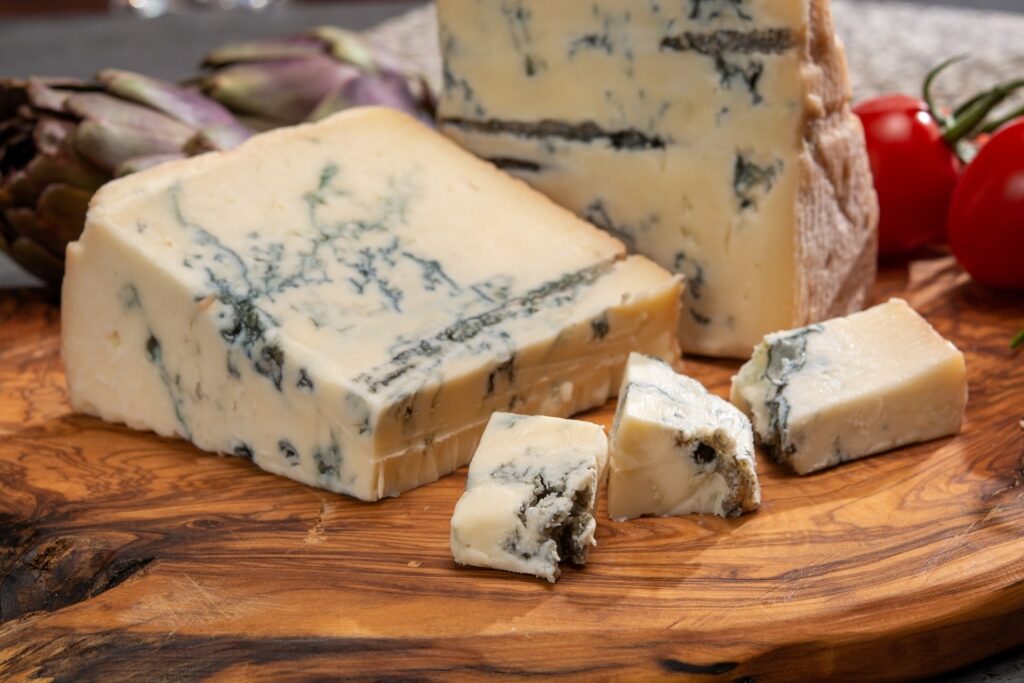 Blocks of gorgonzola on a board