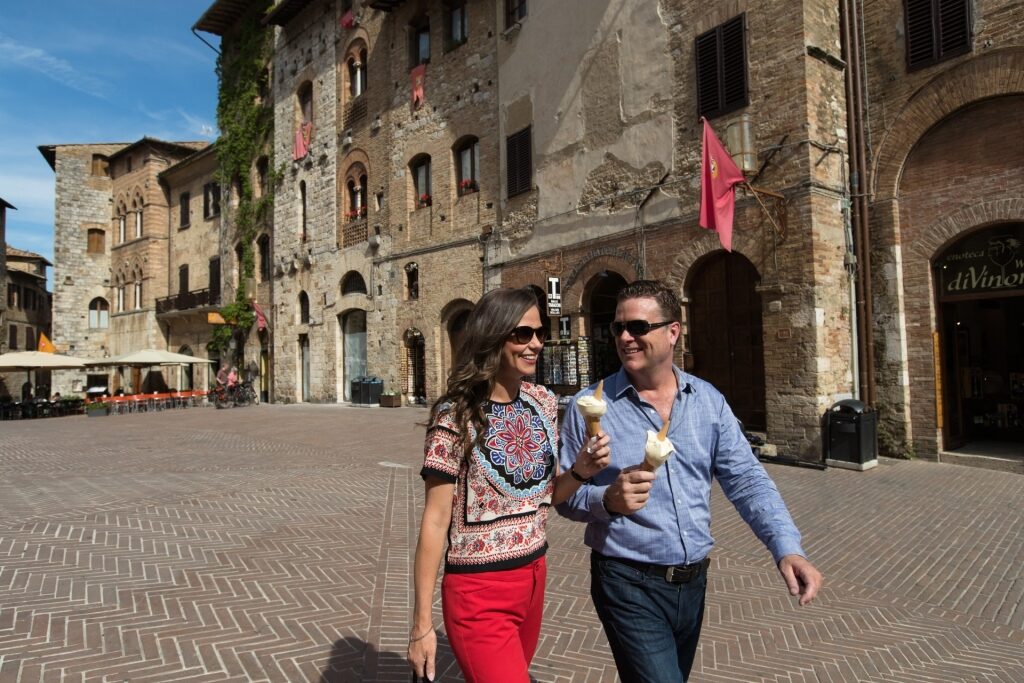 Couple exploring the Tuscan town of San Gimignano