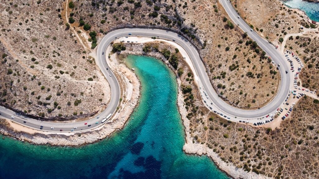 Curve roads towering over Limanakia, Vouliagmeni