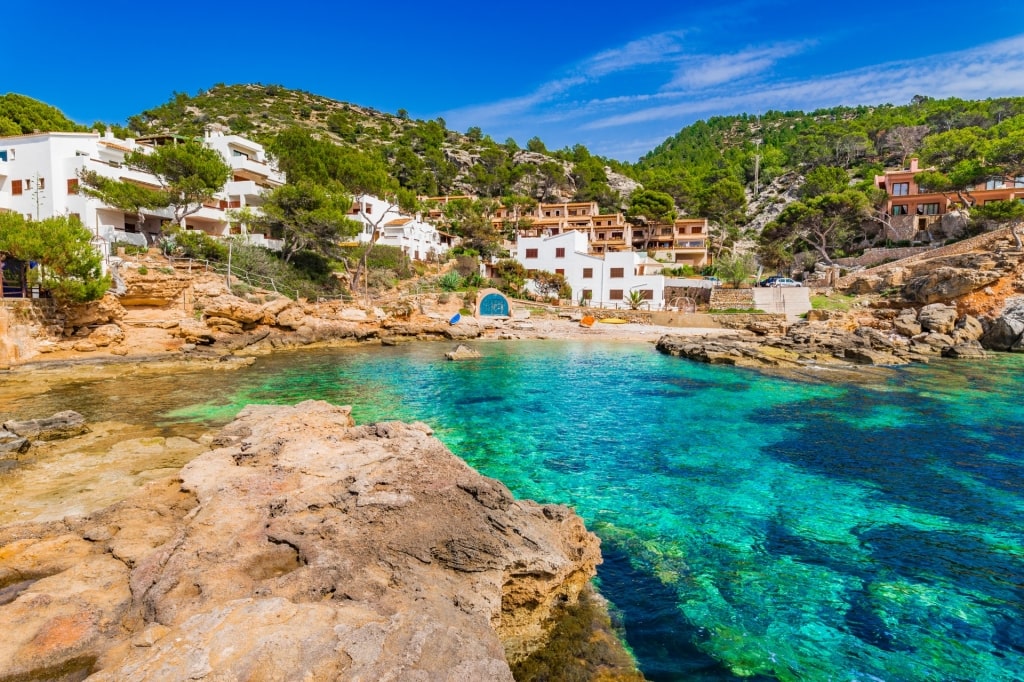 Houses lining the shores of Platja de Sant Elm