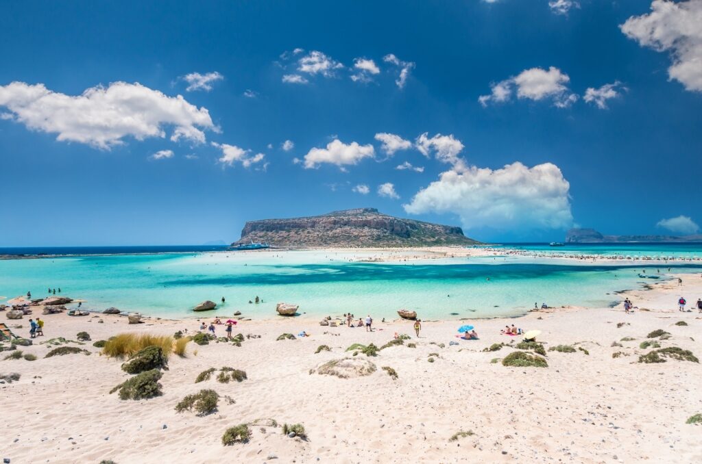 People relaxing on Balos Beach in Crete, Greece