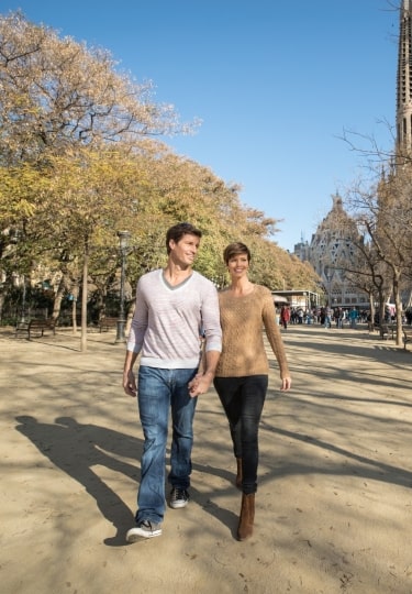 Couple walking in Barcelona during fall in Spain