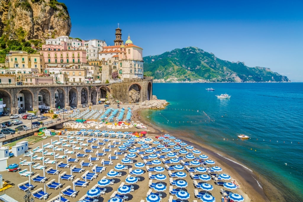 Colorful umbrellas lined up on Spiaggia di Atrani, Atrani