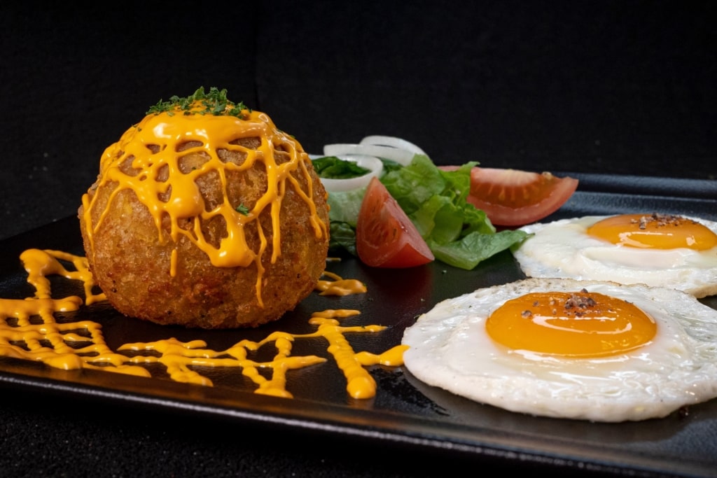 Bolon de verde with egg on the side