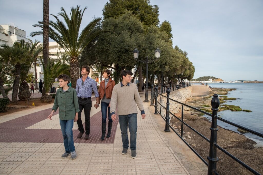 Family strolling Santa Eulària promenade