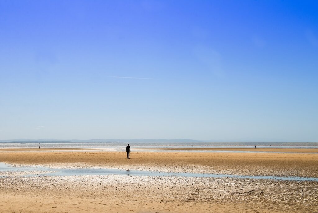 Wide sands of Crosby Beach in Liverpool, England