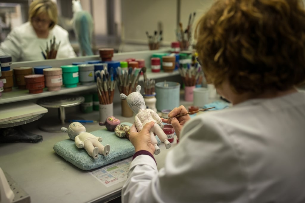 Woman painting figurines