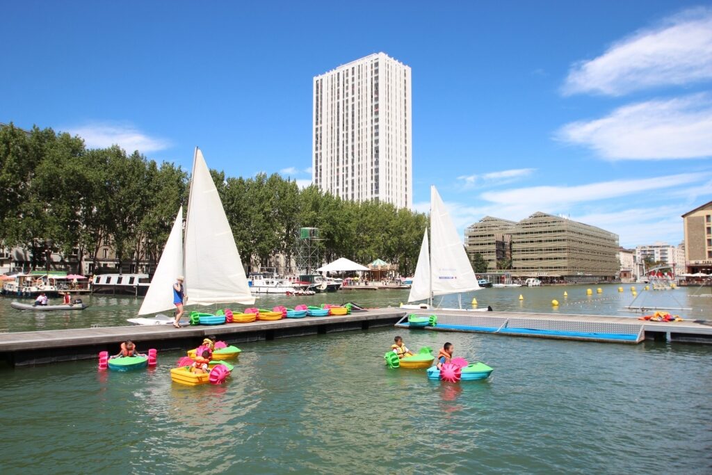 Kids swimming in La Villette Canal Basin, Paris Plages