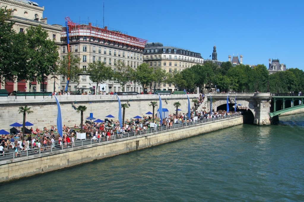 People hanging out at the banks of Paris Plages