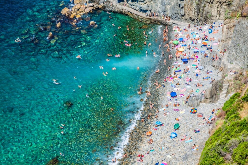 People relaxing on Riomaggiore Beach