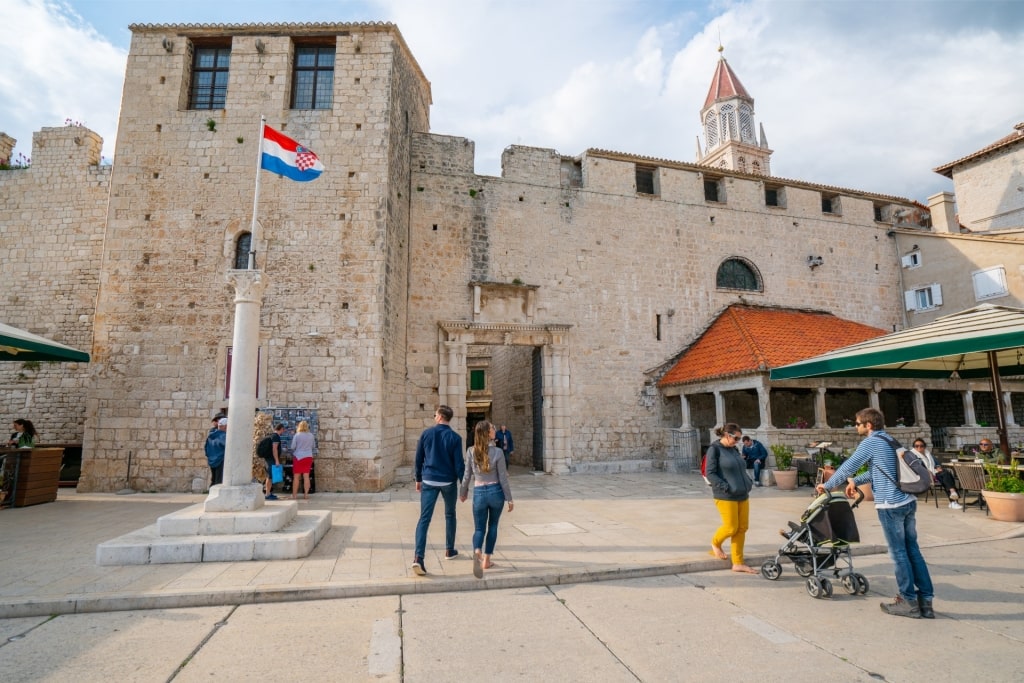 People exploring the old town of Trogir