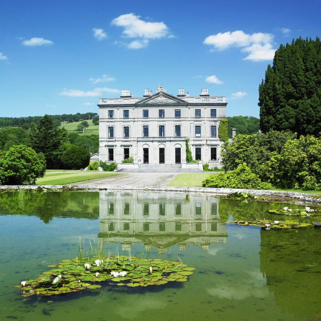 Elegant Curraghmore House & Gardens reflecting on water