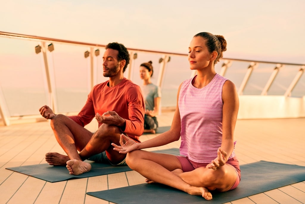 People doing yoga aboard Celebrity Beyond