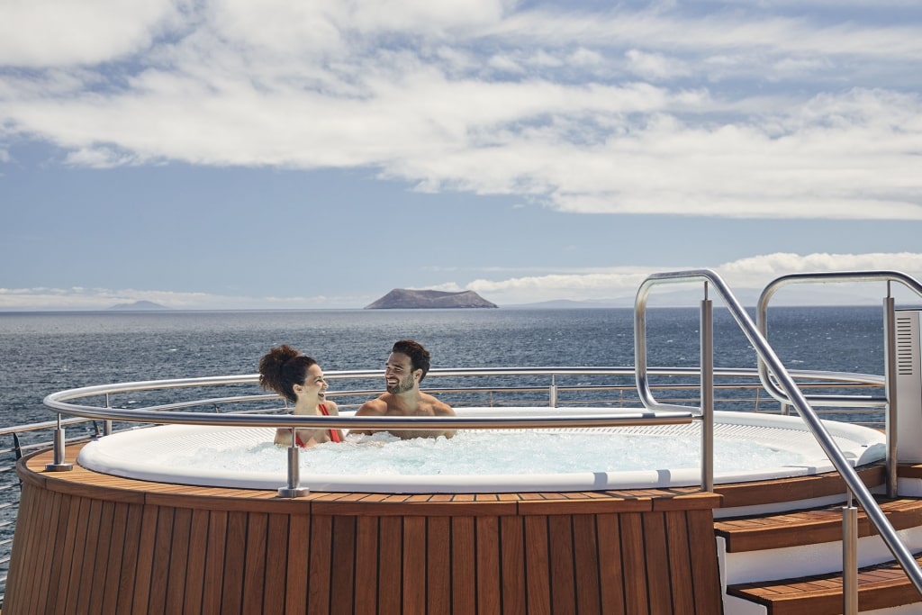 Couple in a jacuzzi on Celebrity Flora