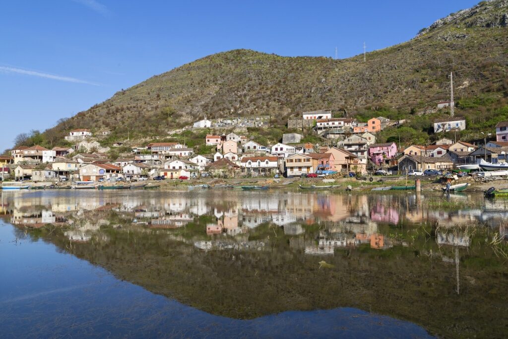 Vranjina town reflecting on water