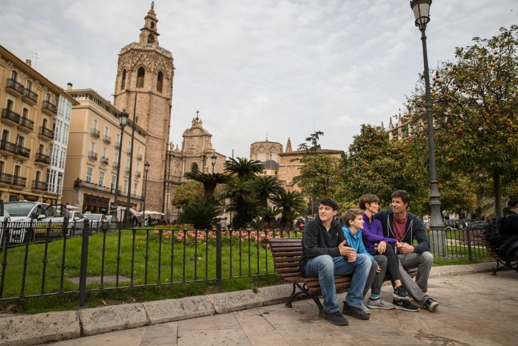 Family people watching in Plaza de la Reina