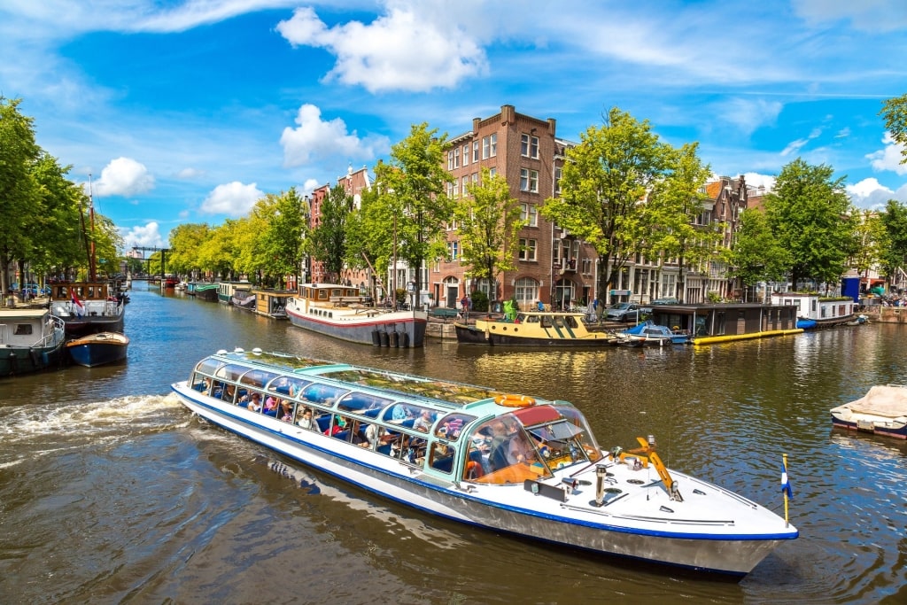 Boat cruising the canals of Amsterdam