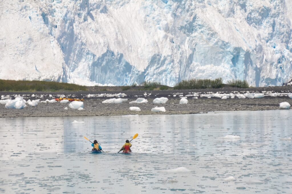 People kayaking in Aialik Bay