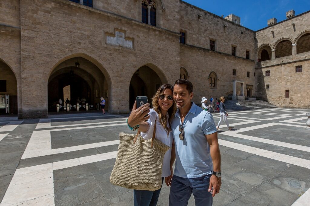 Couple taking a selfie from Palace of the Grand Master of the Knights