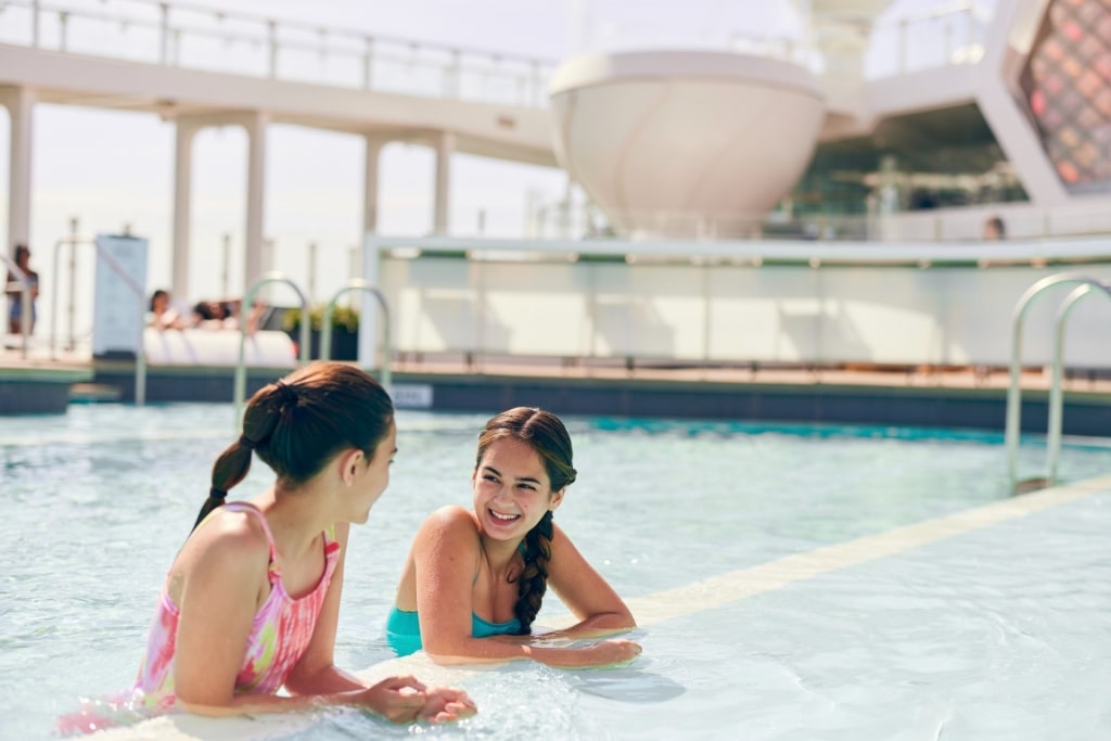 Kids hanging out in a pool on Celebrity Beyond