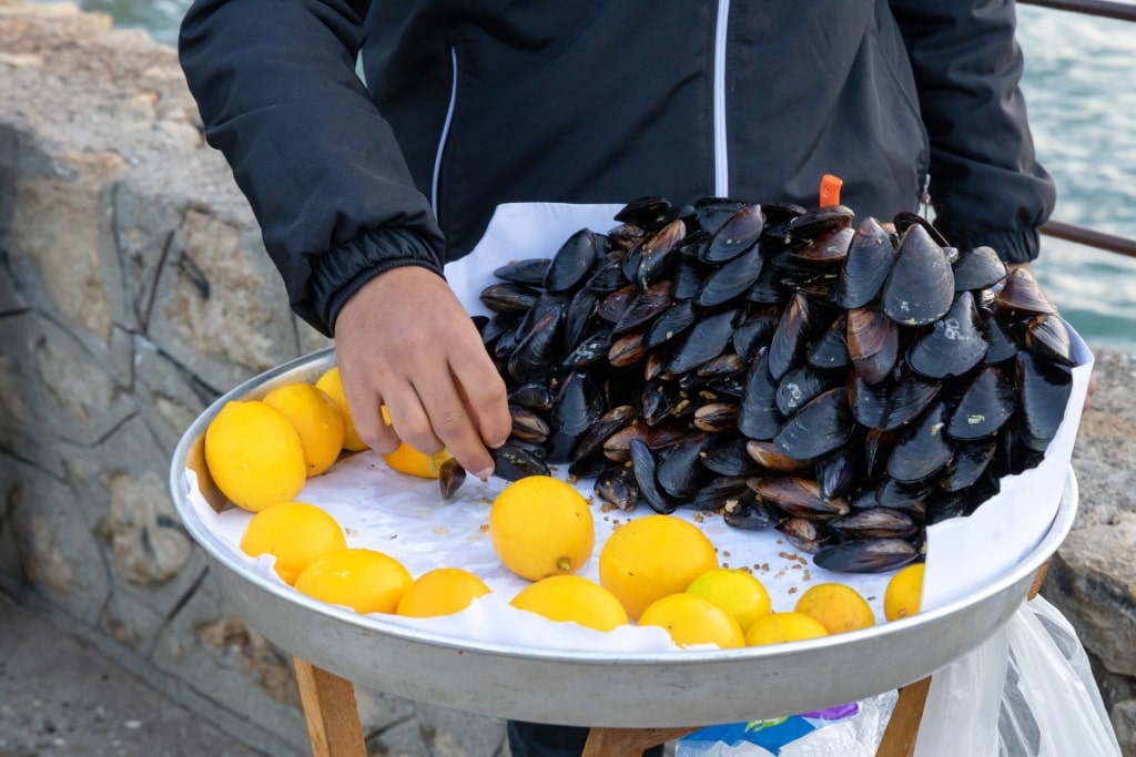 Man selling Midye dolma