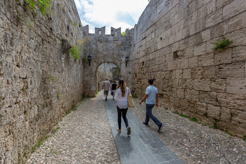 Couple walking through Old Town Walls, Rhodes