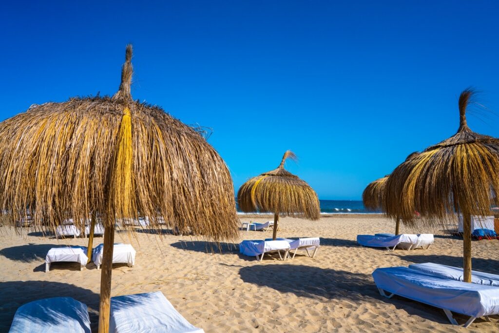 Beach umbrellas on Platja d'en Bossa, Ibiza