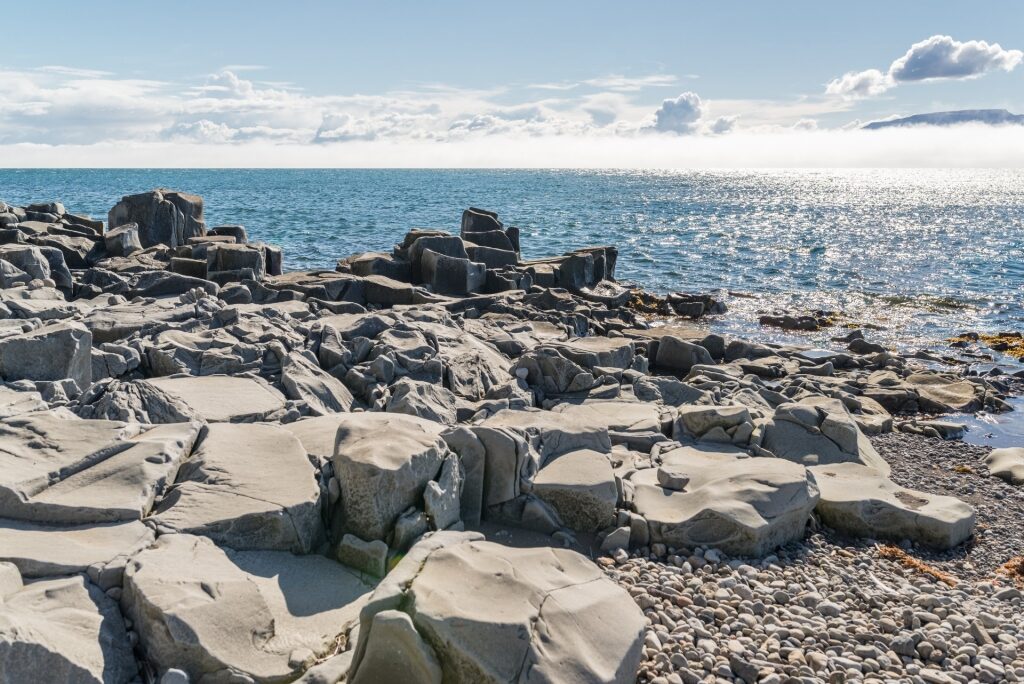 Rocky shoreline of Hofsós Beach, near Akureyri