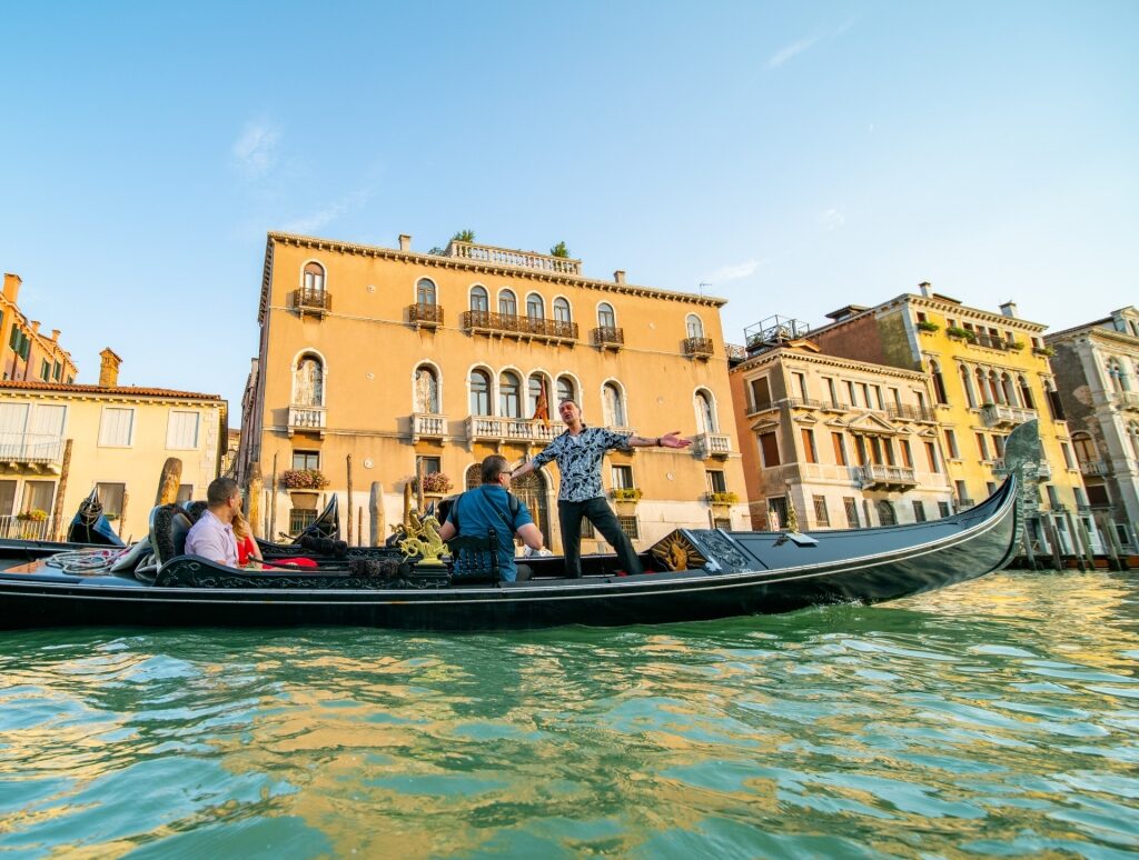 Couple on a gondola ride in Grand Canal, Venice