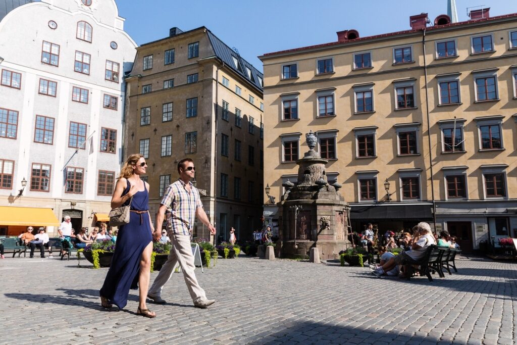 Couple strolling Gamla Stan in Stockholm, Sweden