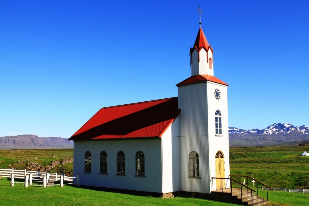 White and red facade of Helgafell church