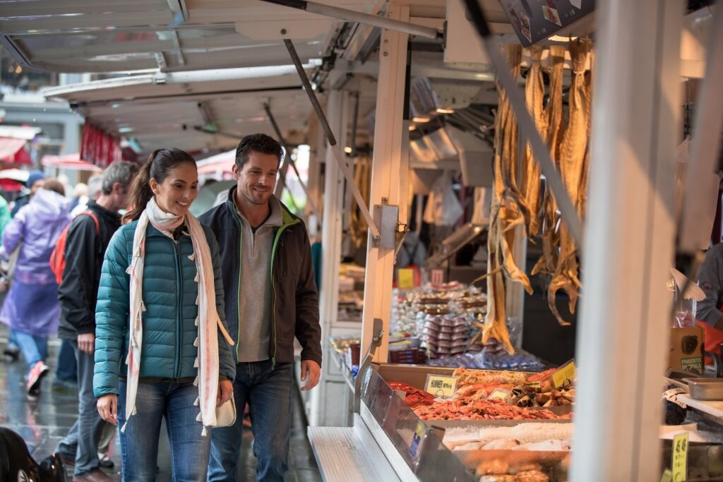 Couple exploring the Fish Market, Bergen