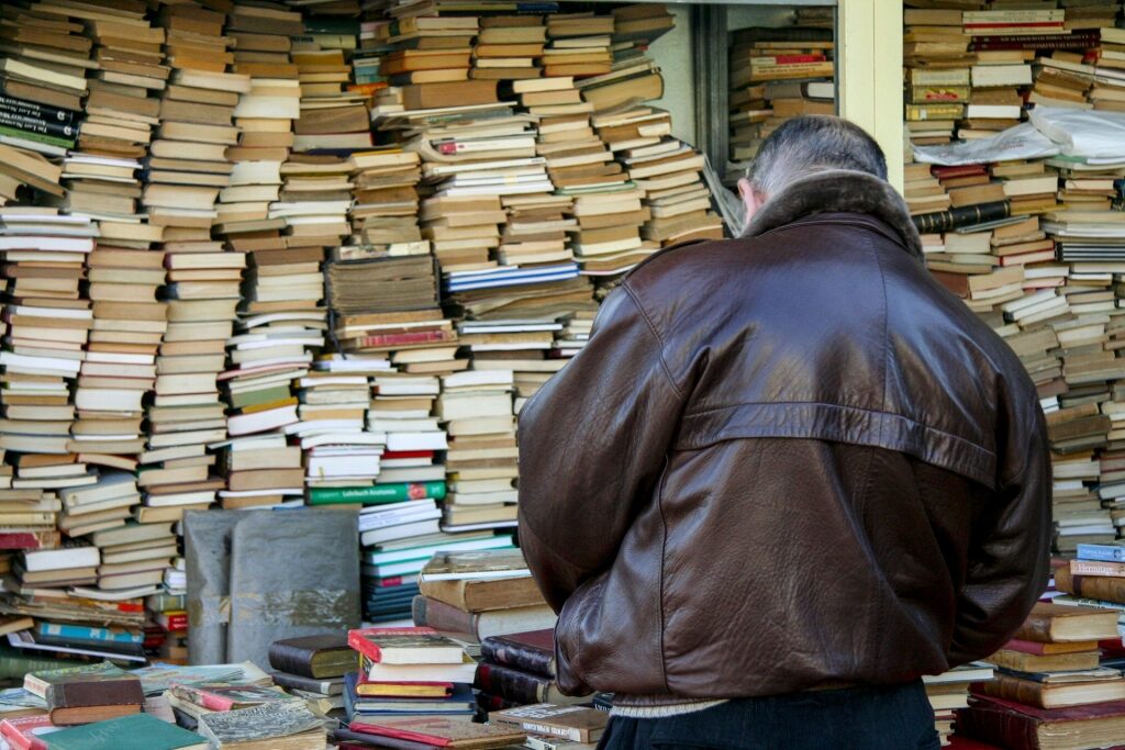 Man browsing books in Encants, El Poblenou