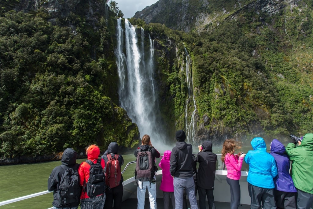 People cruising through Fiordland National Park, South Island