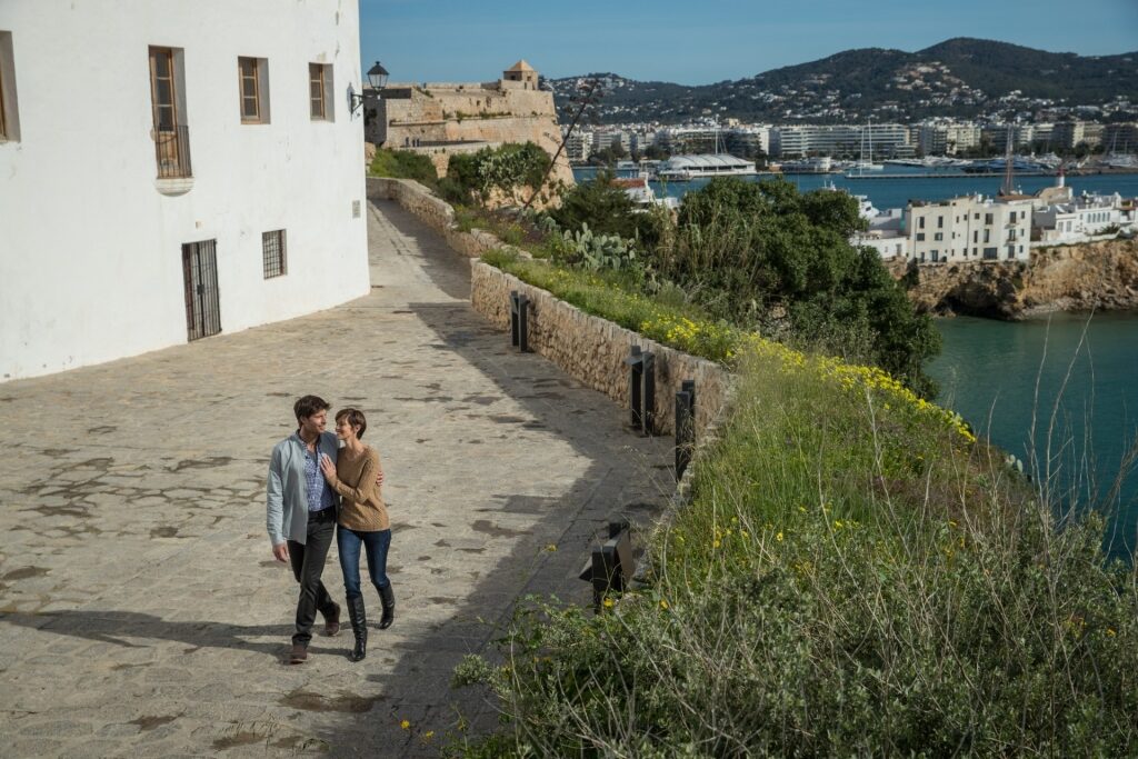 Couple strolling through Ibiza, Spain