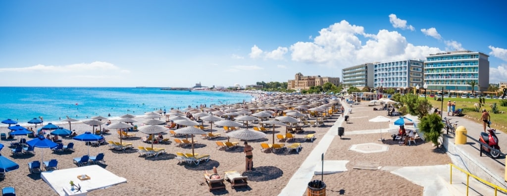 Beach umbrellas lined up on Elli Beach, Rhodes