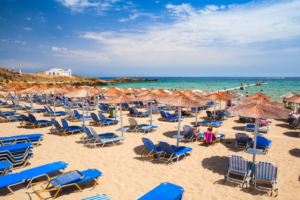 Beach umbrellas lined up on Agios Nikolaos Beach, Zakynthos