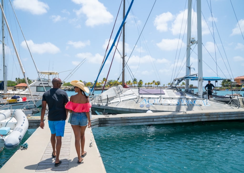 Couple walking along Bonaire waterfront