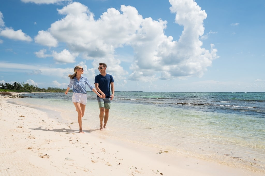 Couple strolling Seven Mile Beach