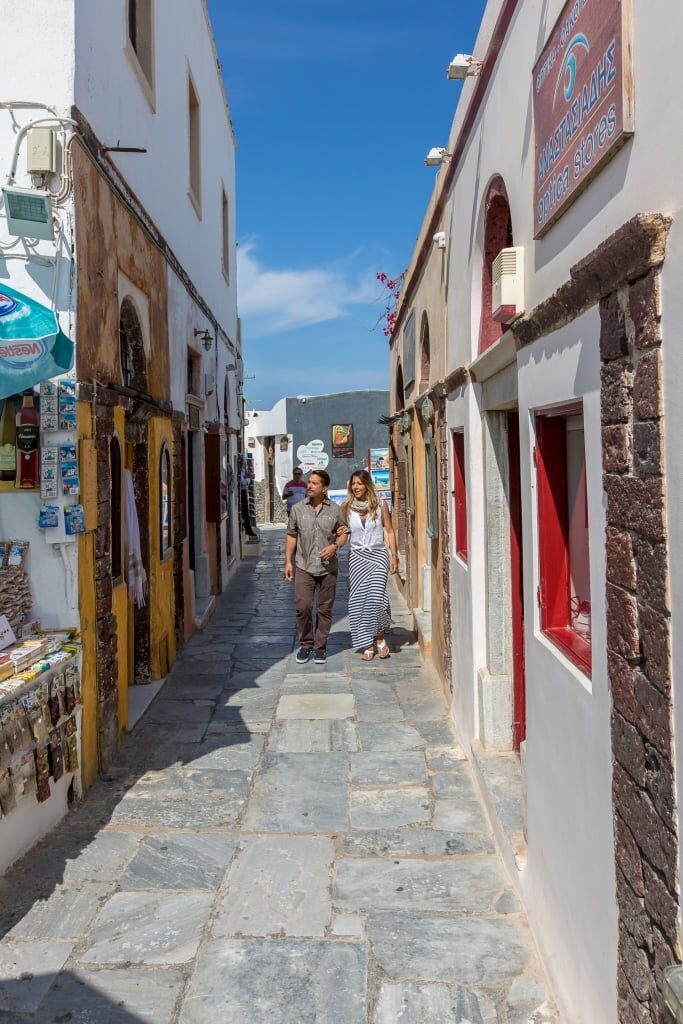 Couple walking the streets of Oia Greece