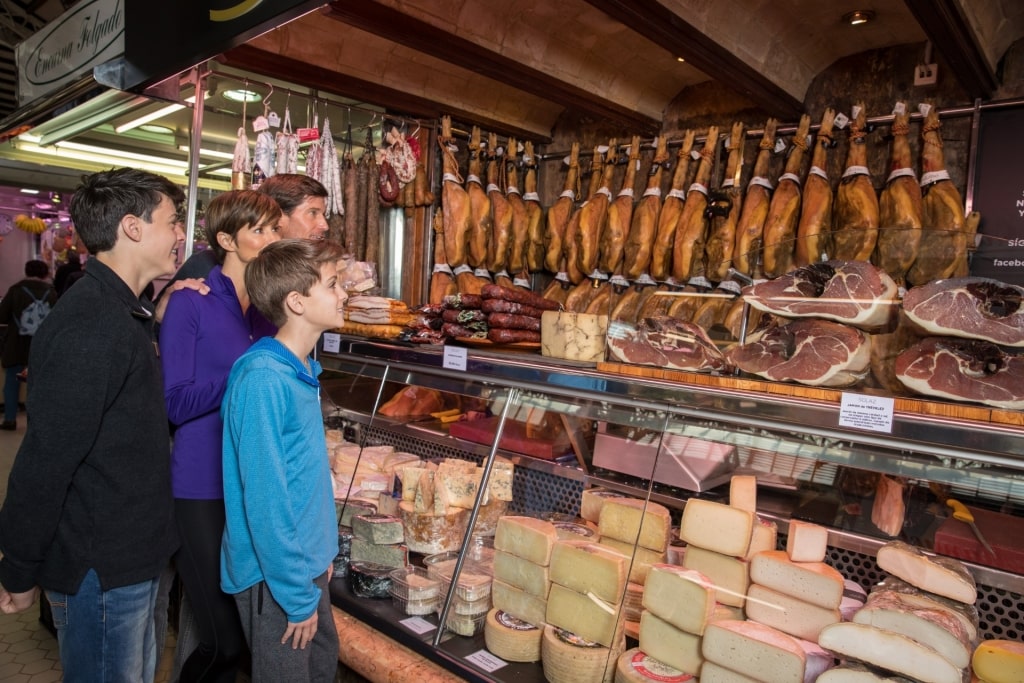 People buying from Valencia Central Market