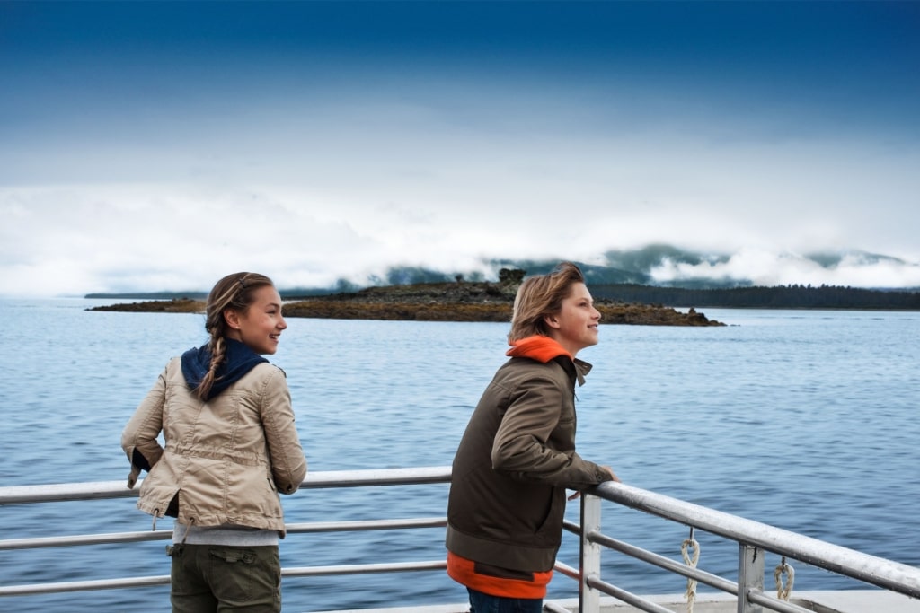 Kids on a whale watching tour in Alaska