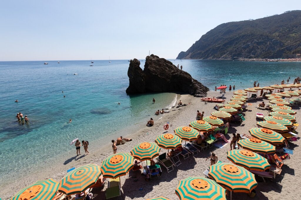 Colorful beach umbrellas lined up on Fegina Beach, Monterosso al Mare