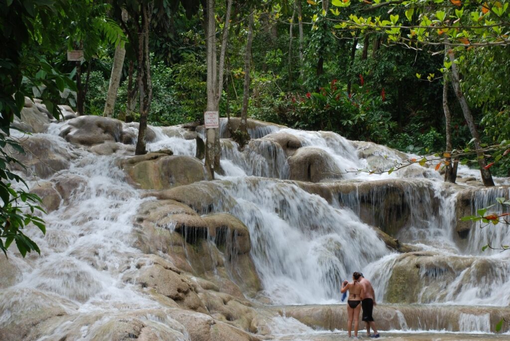 Couple exploring Dunn’s River Falls, Jamaica